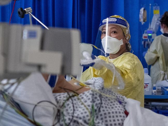 A nurse works on a patient in the ICU (Intensive Care Unit) in St George's Hospital in Tooting, south-west London, where the number of intensive care beds for the critically sick has had to be increased from 60 to 120, the vast majority of which are for coronavirus patients. (Photo by Victoria Jones/PA Images via Getty Images)