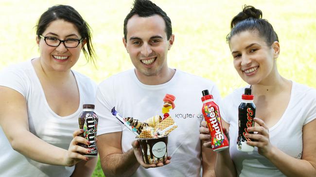 Kayer con’s Samantha, Kaisser and Rose Khater with their delicious desserts. Picture: Peter Kelly