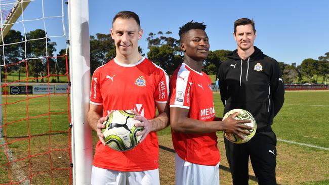 Raiders coach Nik Kuzman (right) with players Michael Paleka and Omari Didero. Picture: Keryn Stevens/AAP