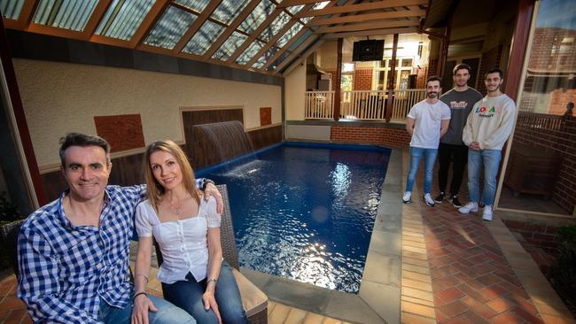 Michael and Annitta Eliopoulos and their kids Julian, Nic and Adam, at their period-style house with an indoor pool in Watsonia North. Picture: Tony Gough