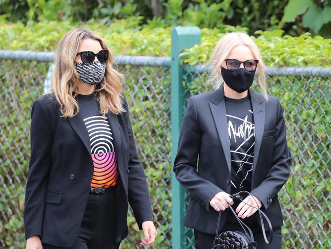 Dannii and Kylie Minogue arrive to farewell their friend. Picture: Alex Coppel