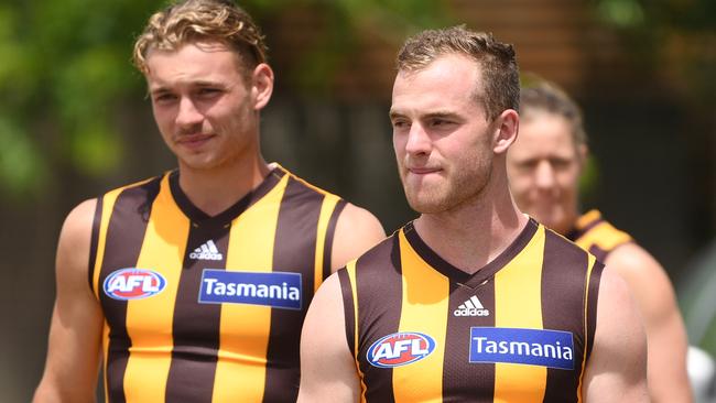 Hawthorn players Tom Mitchell (left) and James Worpel in pre-season training are looking forward to putting on a good show for members. Picture: AAP/Julian Smith