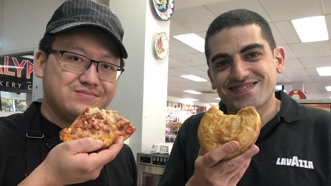 Ben Chen and Joseph Portelli’s son, Joseph, devour pizza and pies.