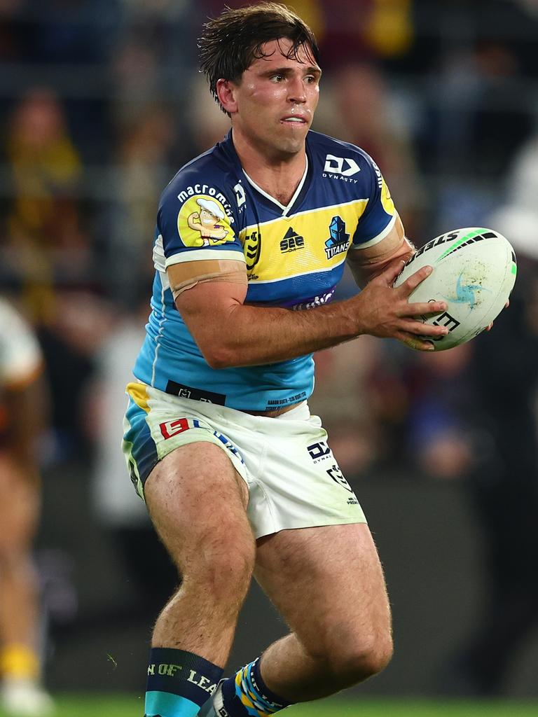 Aaron Booth of the Titans passes during the round 18 NRL match between the Gold Coast Titans and the Brisbane Broncos at Cbus Super Stadium, on July 16, 2022, in Gold Coast, Australia. (Photo by Chris Hyde/Getty Images)