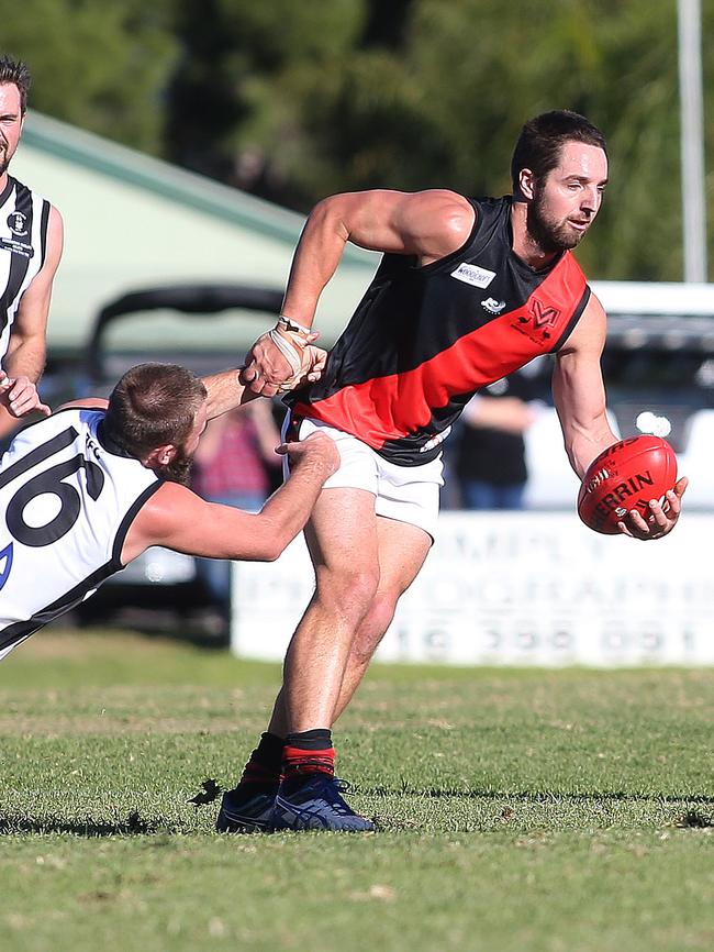 Emus captain Michael Smith in action against Reynella, his club’s arch rival. Picture: Stephen Laffer