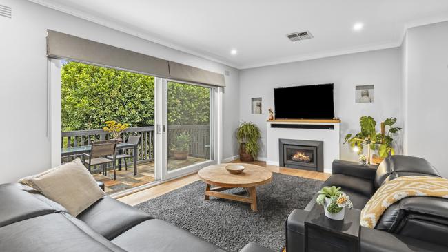 A deck steps into the garden off the main living area.