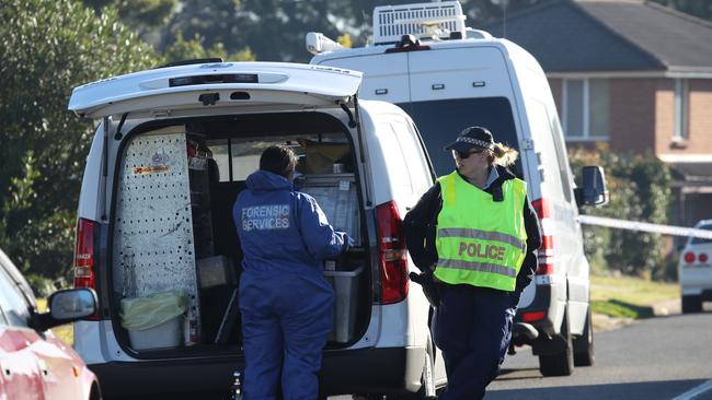 Investigators at the scene of the alleged murder. Picture: David Swift.