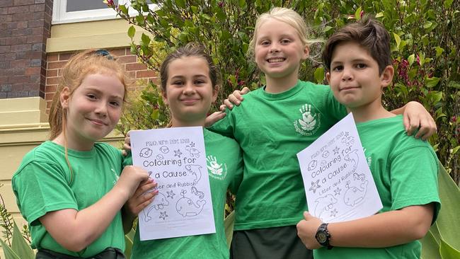 Ipswich North State School Year 5 students and EcoMarines ambassadors Rebecca Meale, Sophie Gardner, Faith Hardaker, and Nathaniel Carey with their ‘Colouring for a Cause’ book. Picture: Jessica Baker / The Queensland Times