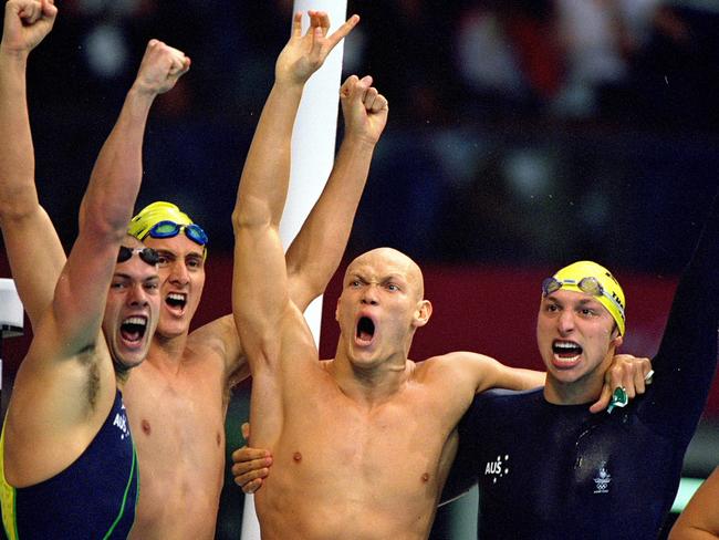 16 Sep 2000:  (L to R) Ashley Callus, Chris Fydler, Michael Klim and Ian Thorpe of Australia celebrate after winning Gold in the Mens 4 x 100m Freestyle Relay at the Sydney International Aquatic Centre during Day One of the Sydney 2000 Olympic Games in Sydney, Australia. They won the Gold in a World Record time of 3 mins 13.67 secs. Mandatory Credit: Al Bello /Allsport