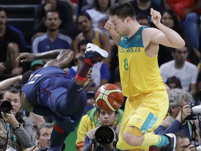 Paul George (13) and Australia's Matthew Dellavedova.