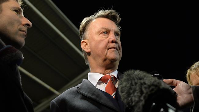 Manchester United manager Louis van Gaal (C).