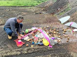 COLLECTING EVIDENCE: Phil Manning from Lismore City Council investigates dumped materials at Lindendale.