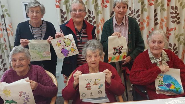 Art creation: Kellock Lodge residents with their COVID journey flags.