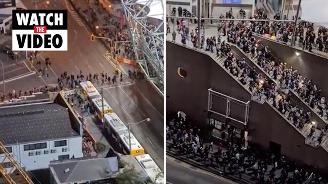 Thousands of fans leave the Gabba