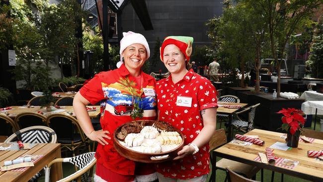 Volunteers Heather Davis-Schnierer with partner Erin Davis-Schnierer. Colony47 Christmas Day lunch at In The Hanging Garden. Picture: Nikki Davis-Jones