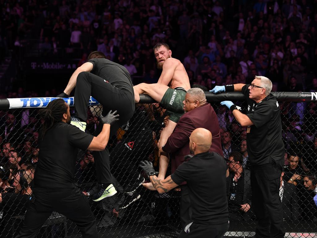 Conor McGregor attempts to leave. (Photo by Josh Hedges/Zuffa LLC/Zuffa LLC)