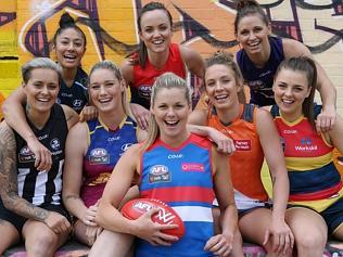 AFL Women's players parade next season's jumpers.