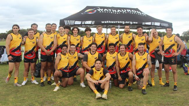 The Wathaurong team with former Geelong player Matthew Stokes up the front. Picture: Sharlene Vale