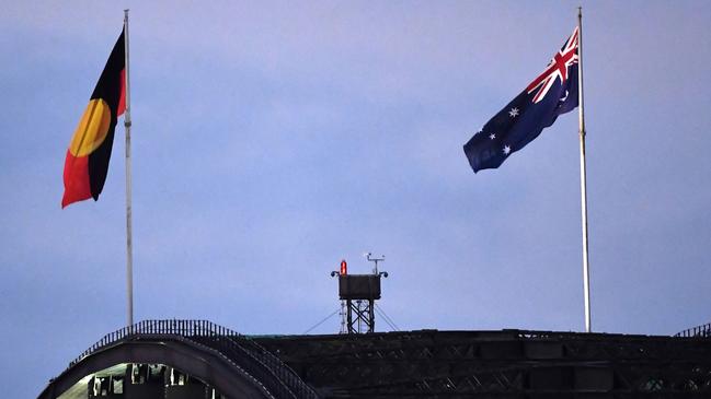 The Aboriginal flag flies beside Australia's national flag over the Sydney Harbour Bridge. Picture: AFP