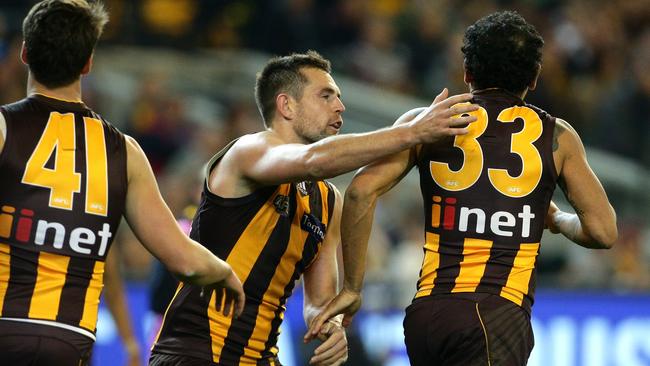 Luke Hodge with Cyril Rioli in 2015. Picture: Mark Dadswell