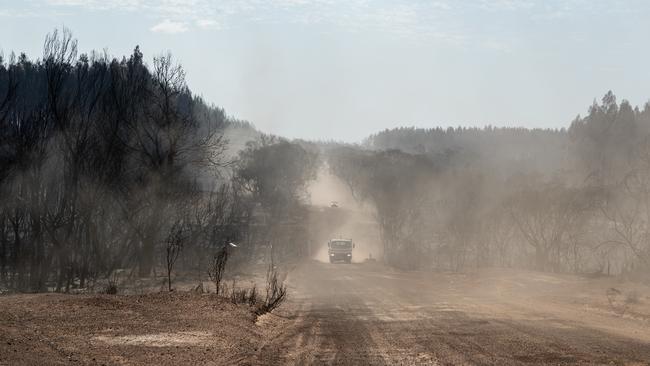 Firefighters drive down Turkey Lane on Kangaroo Island. Picture: Brad Fleet