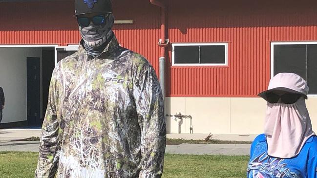 Voters taking precautions from coronavirus at the Pacific Pines primary school on the Gold Coast during the council poll. Photograph: Paul Weston.