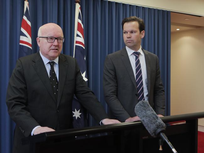 Senator Matt Canavan (right) announced he was standing aside at a media conference with Attorney-General George Brandis. Picture: Tim Marsden/AAP