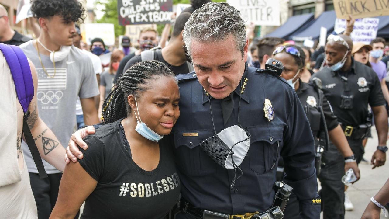 Denver Police Chief Paul Pazen embraces a woman during a march against the death of George Floyd in police custody in Minneapolis. Picture: Michael Ciaglo/Getty Images/AFP