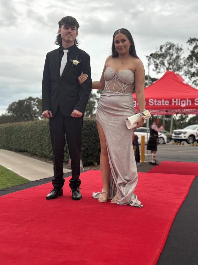 The students of Urangan State High School arriving at their formal.