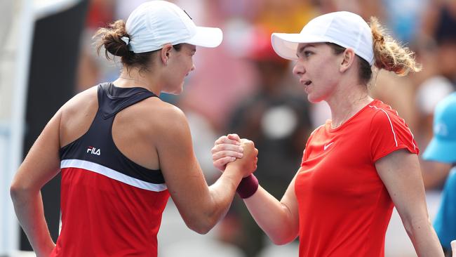 Ash Barty shakes hands with Simona Halep. Picture: Brett Costello