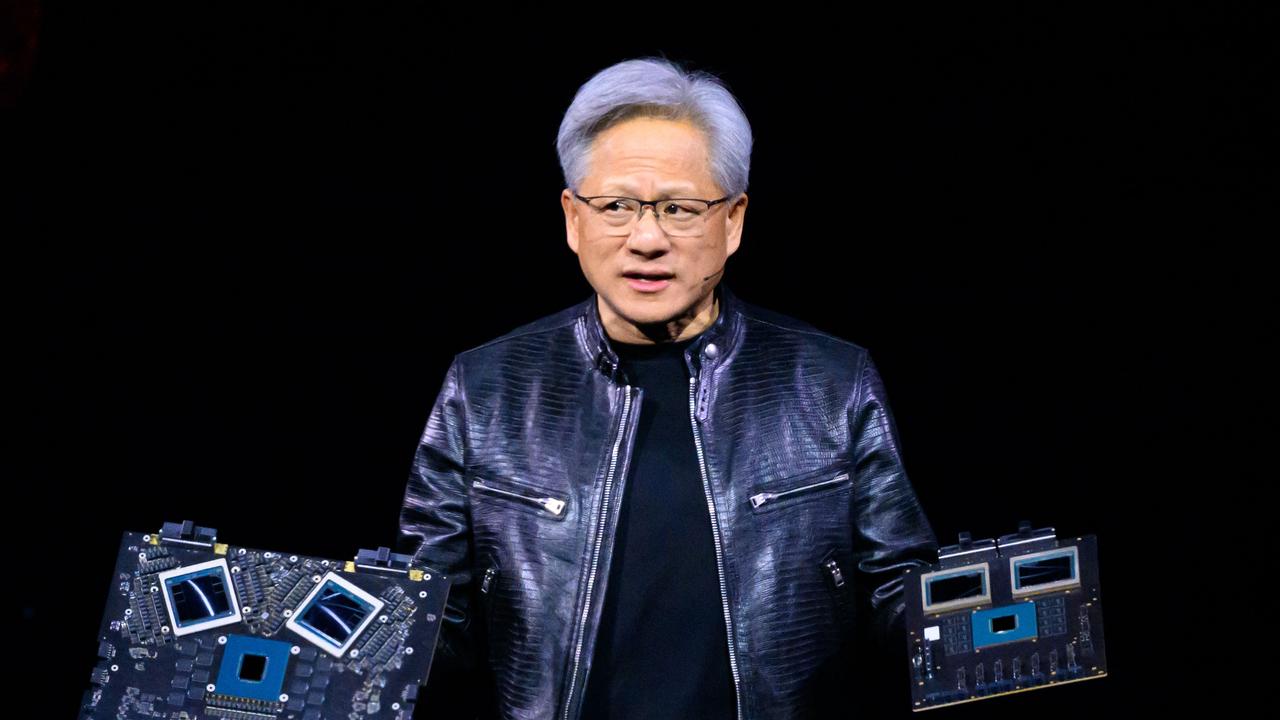 Nvidia chief executive Jensen Huang displays products on stage during the annual Nvidia GTC artificial intelligence conference. Picture: AFP