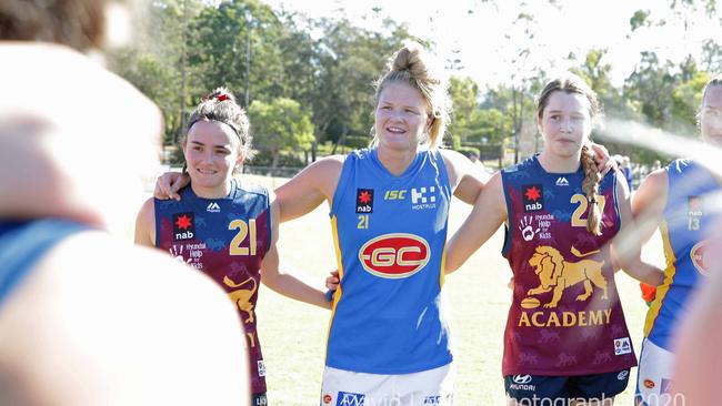 Beth Pinchin (middle) pictured alongside Lions players Abby Hewitt (left) and Grace Pearson-Smith (right) would look right at home in AFLW colours. Pic: David Layden Photography.