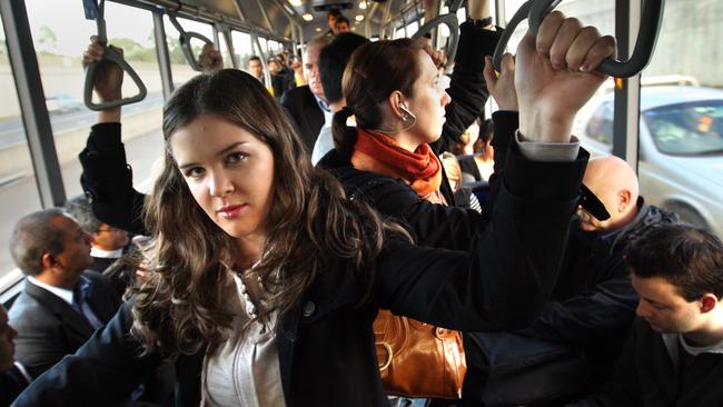 Commuter Joanna Lambert stands on overcrowded Castle Hill to Sydney CBD bus after boarding at Baulkham Hills.