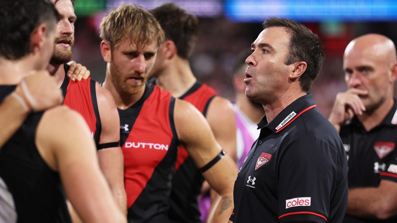 SYDNEY, AUSTRALIA - MARCH 23: Bombers head coach Brad Scott speaks to players at three quarter time during the round two AFL match between Sydney Swans and Essendon Bombers at SCG, on March 23, 2024, in Sydney, Australia. (Photo by Matt King/AFL Photos/via Getty Images )