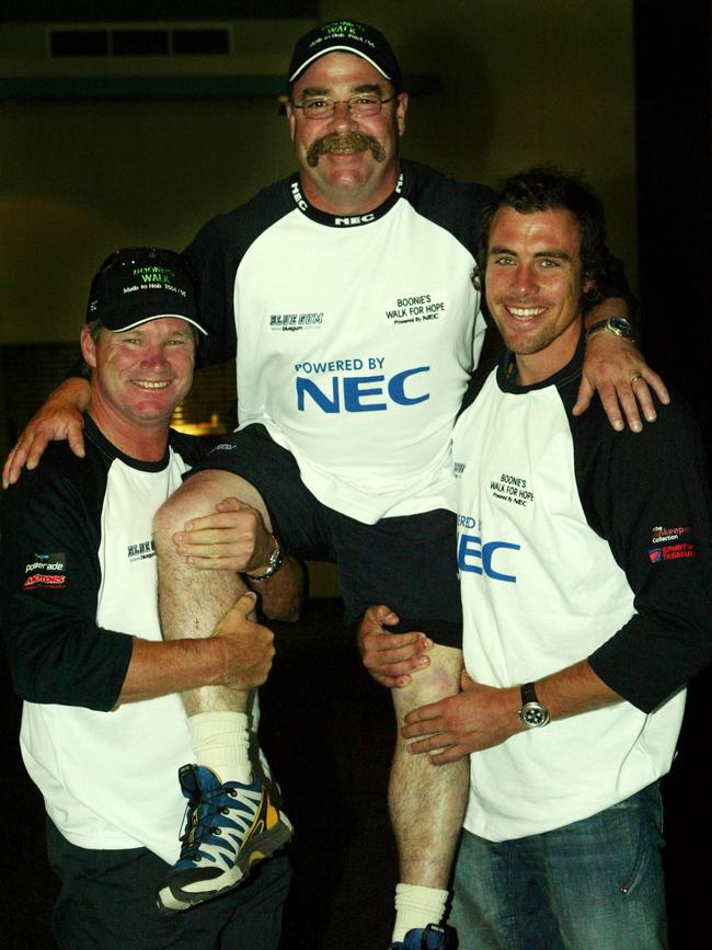 The David Boon charity walk of hope. Dean Jones and Matthew Richardson give David Boon a hand at the start of his walk.