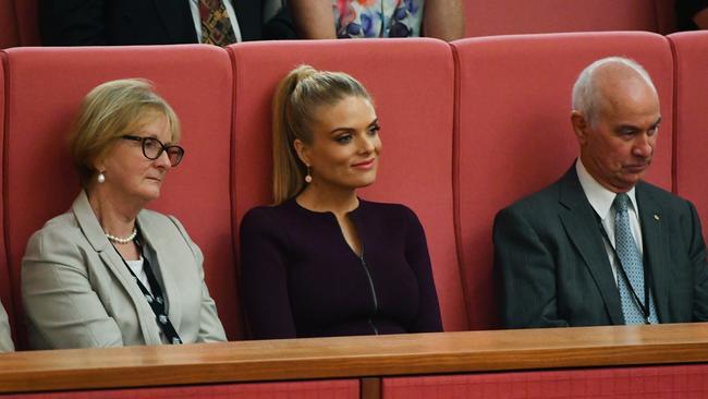 Erin Molan listened to her father Liberal Senator Jim Molan makes his maiden speech in the Senate chamber at Parliament House on Wednesday. Picture: AAP Image/Mick Tsikas