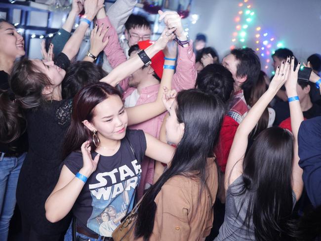 Young Yakutians let loose in a well-heated nightclub in Yakutsk. Picture: Picture: Amos Chapple/REX/Shutterstock/Australscope