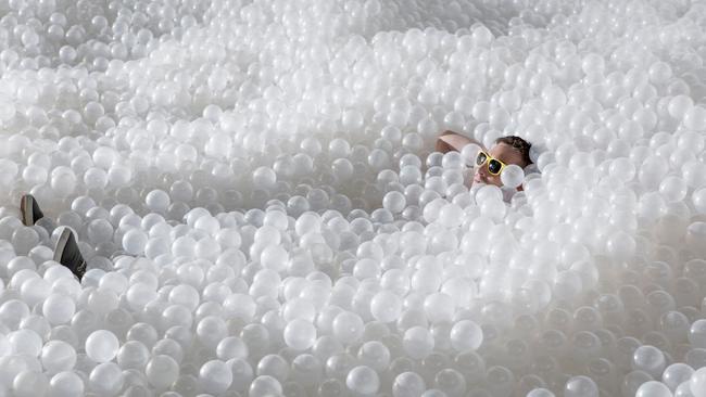 Families can make waves in a sea made up of a million recyclable polythene balls at Barangaroo.