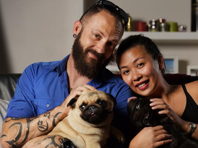 Stuart Park resident Dan Reimers, who owns pugs Rose and Clive with his partner Eva Luntok, says the restrictions are fair. Picture: Keri Megelus 