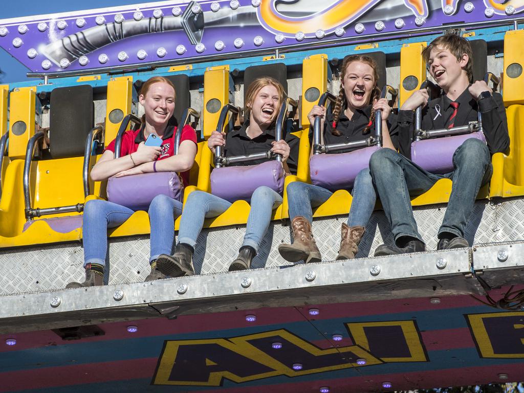 Xavier College students (l-r) Christelle Boi, 16, Natasha Dollin, 16, Kaitlyn Glover, 15 and Daniel Bills, 15, enjoying the Ali Baba ride.