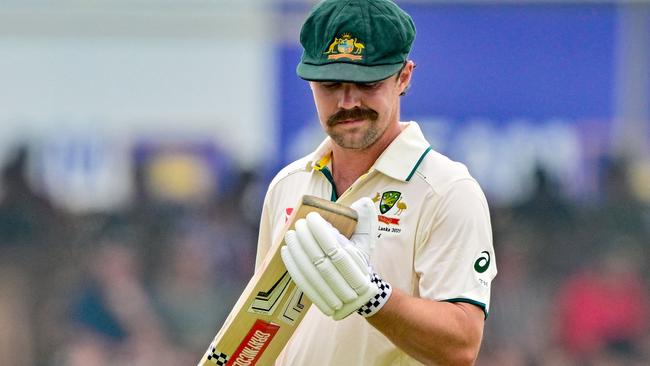 Australia's vice captain Travis Head walks back to the pavilion after his dismissal during the first day of the first Test cricket match between Sri Lanka and Australia at the Galle International Cricket Stadium in Galle on January 29, 2025. (Photo by Ishara S. KODIKARA / AFP)