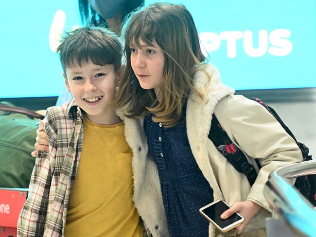 The siblings, who were separated in transit, were relieved to be reunited at Sydney Airport. Picture: Jeremy Piper