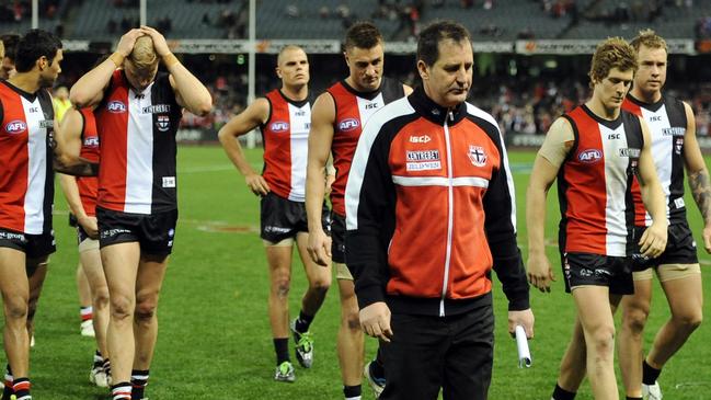 Ross Lyon leads the Saints off after their 2011 elimination final loss — his last in charge at the club.