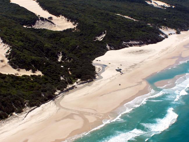 A tourist attacked police during a trip to Fraser Island.