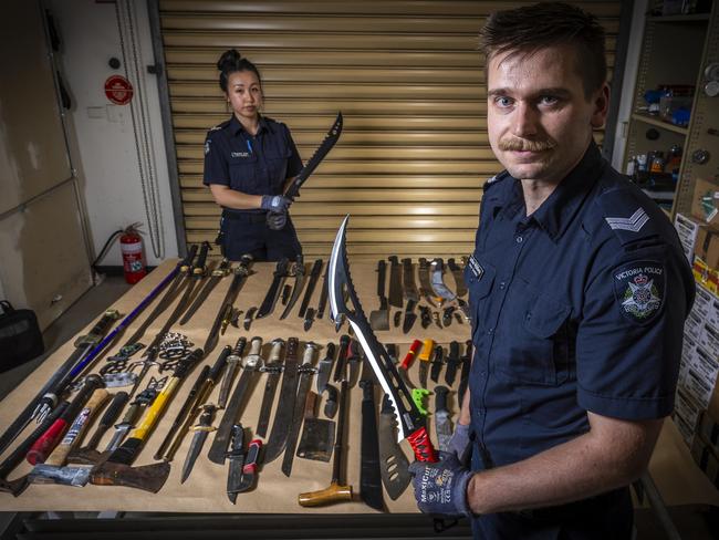 Police have seized a record number of knives. Senior Constable Michelle Chan and Senior Constable Lachlan McGillivray display a selection of the confiscated knives. Picture: Jake Nowakowski