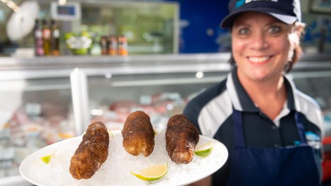 Darwin wholesaler Mr Barra has started selling sea cucumber for the first time and they're already proving to be pretty popular. Carolyn Margetic from Mr Barra shows off a fresh catch of the echinoderms. Picture: Che Chorley