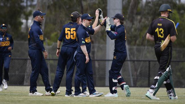 Strathmore players celebrate the wicket of Box Hill batsman and captain, James Box, out for one run. Picture: Andrew Batsch