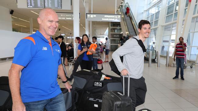 TDU Director Stuart O’Grady (L) greets INEOS Grenadier team member Ben Swift (R) at Adelaide Airport. Picture: Dean Martin