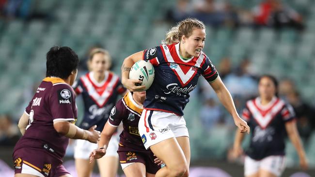 Isabelle Kelly on the charge for the Roosters against the Broncos. Picture: Getty Images