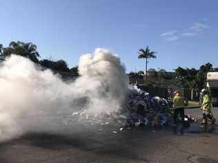 A large pile of rubbish caught on fire at Little Mountain this morning. Photo: Paul Bartolo